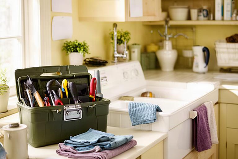Bright Irish kitchen and utility area with a neatly arranged toolbox beside a sink and household notes